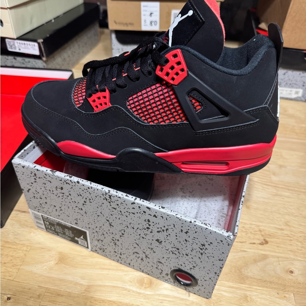 Jordan Retro 4 Low-Top in Black and Red